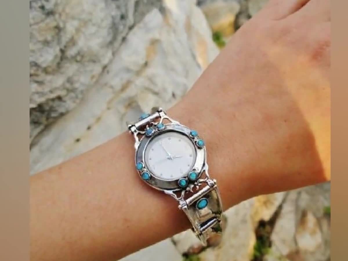 Women's white and online silver watch. Opalescent face.